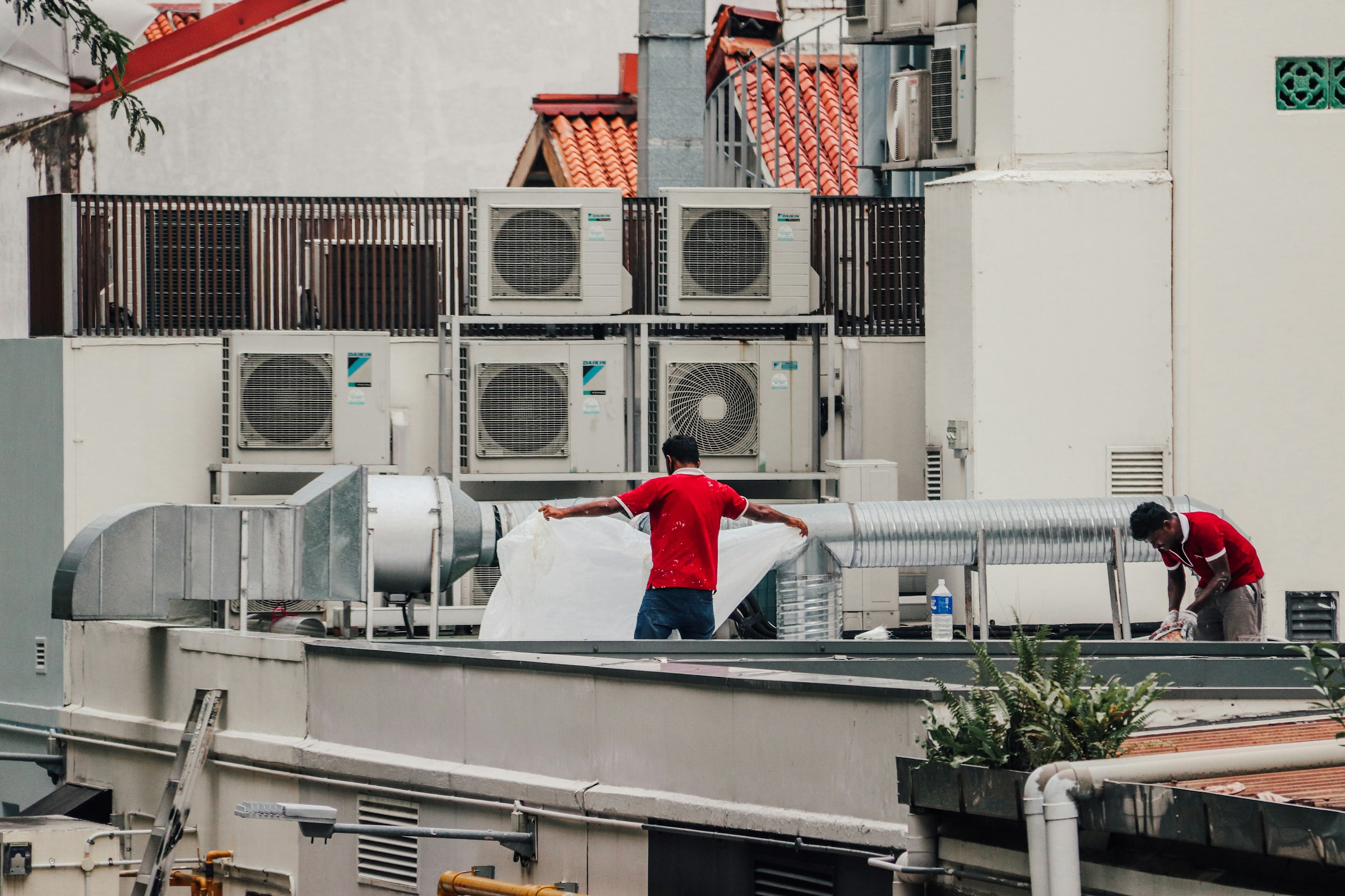 Hermes HVAC crew working on a commercial rooftop